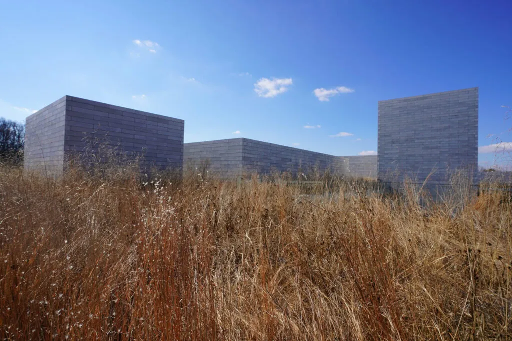 A dormant meadow in winter in front of the Glenstone Museum